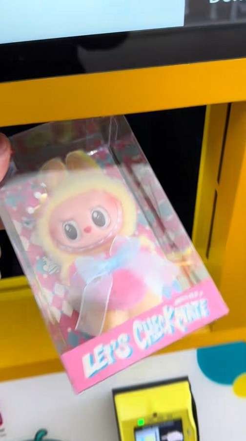 customer taking labubu blind box out of elevator vending machine zero drop delivery intact seal